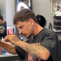 Aaron Diacono cutting hair at Seven17 Barber Shop