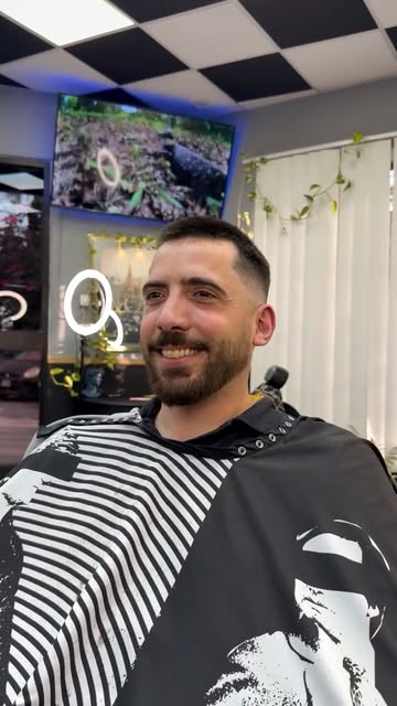 Smiling client after a fresh Seven17 cut